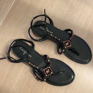 Cole Haan black leather sandals with wooden appliqués